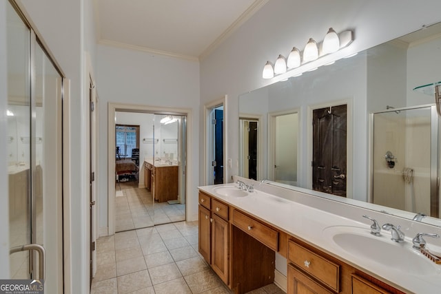 bathroom with crown molding, tile patterned floors, vanity, and walk in shower