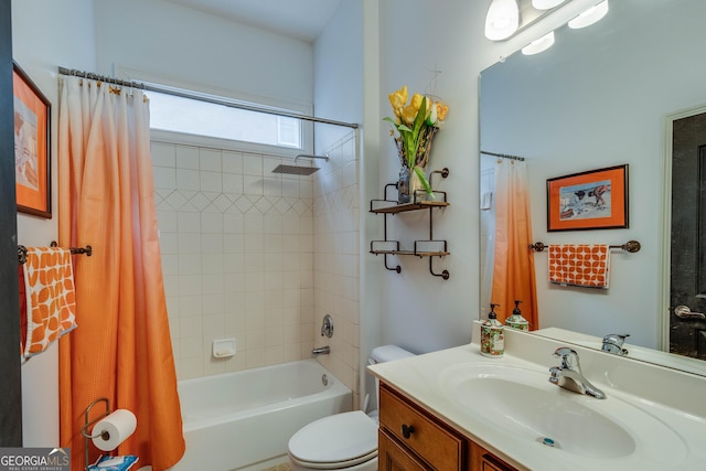 full bathroom with shower / tub combo with curtain, vanity, and toilet