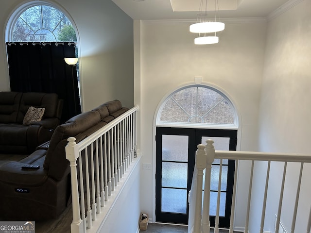 entryway featuring crown molding