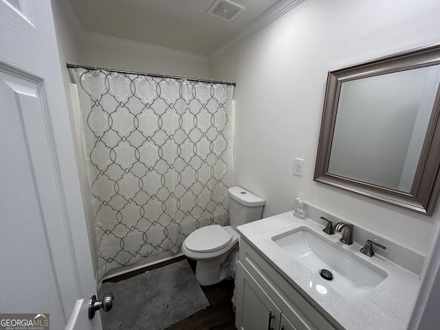 bathroom featuring crown molding, hardwood / wood-style flooring, a shower with shower curtain, vanity, and toilet