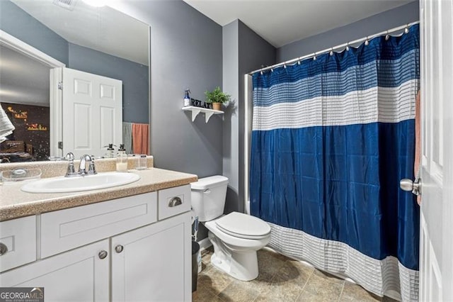 bathroom with vanity and toilet