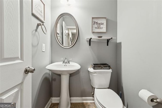 bathroom featuring sink and toilet