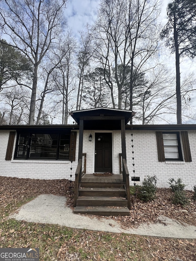 view of front of house featuring brick siding