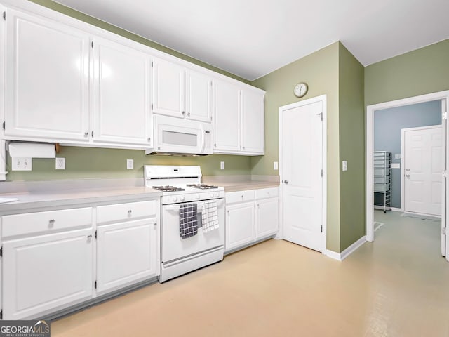 kitchen with white cabinets and white appliances