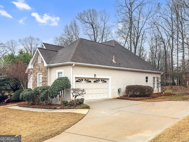 view of side of property featuring a garage