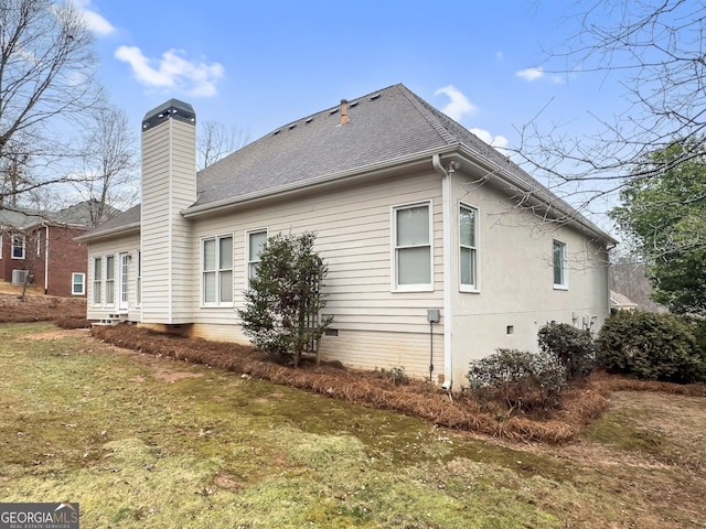 view of home's exterior featuring a yard