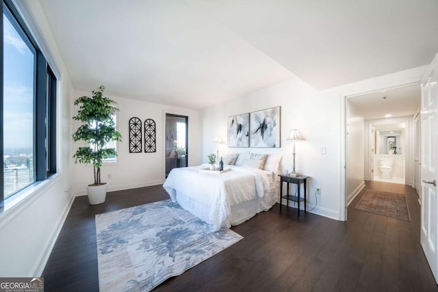 bedroom featuring dark hardwood / wood-style flooring