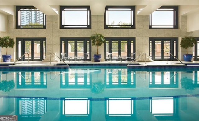 view of pool with french doors