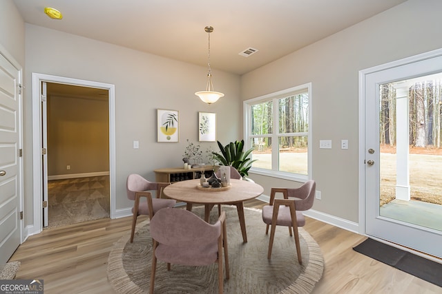 dining space featuring light hardwood / wood-style floors