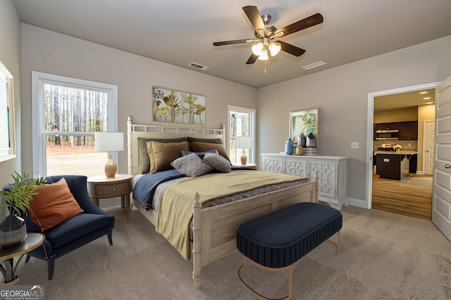 carpeted bedroom featuring ceiling fan