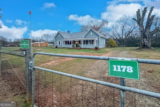 view of front of property with a porch and a front lawn