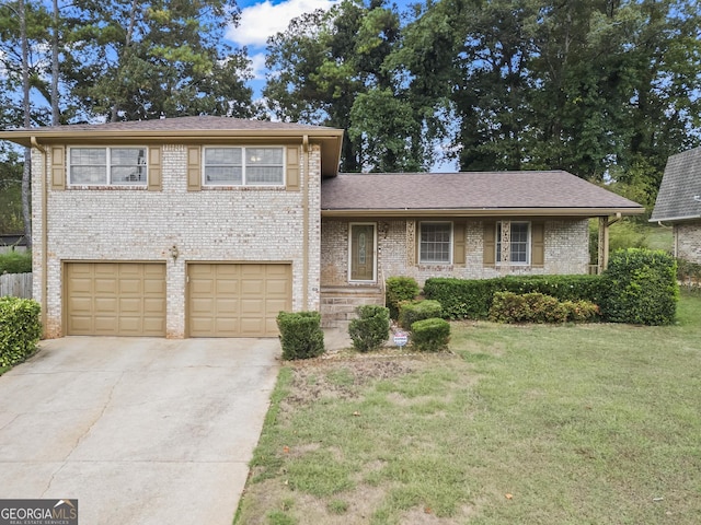 split level home featuring a garage and a front yard