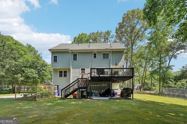 back of property featuring fence, a patio, stairs, a deck, and a lawn