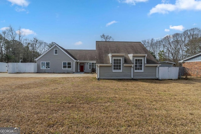 back of house with a yard