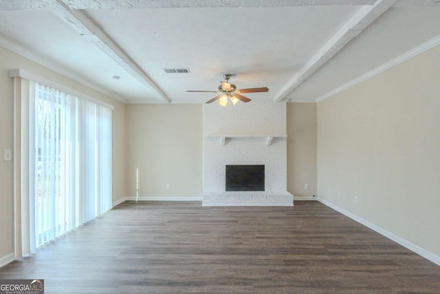 unfurnished living room featuring dark hardwood / wood-style flooring, a fireplace, beamed ceiling, and ceiling fan