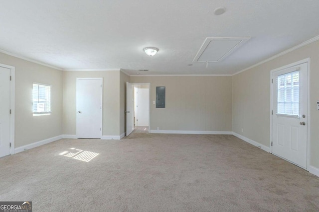 unfurnished room with crown molding, light carpet, and electric panel