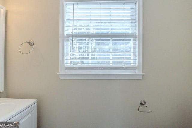 bathroom with plenty of natural light and vanity