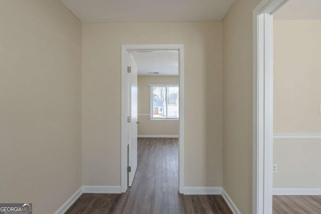 hallway featuring dark hardwood / wood-style floors