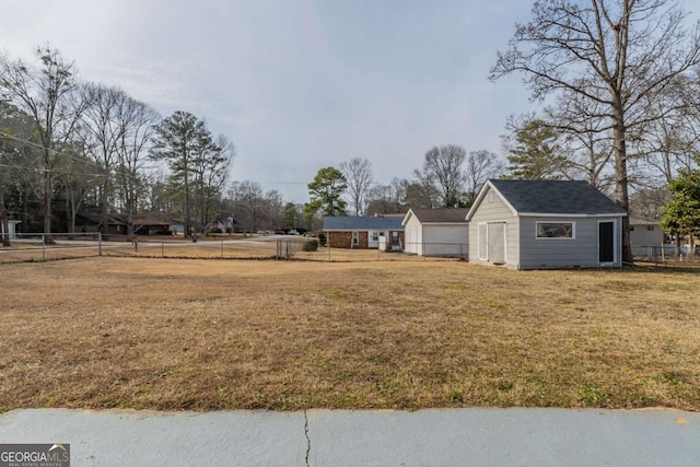 view of yard featuring a storage unit