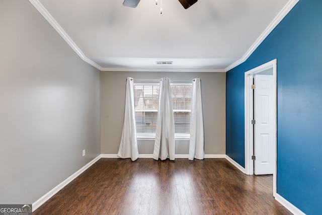 spare room featuring ornamental molding, dark wood-type flooring, and ceiling fan