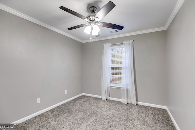 carpeted spare room with ornamental molding and ceiling fan