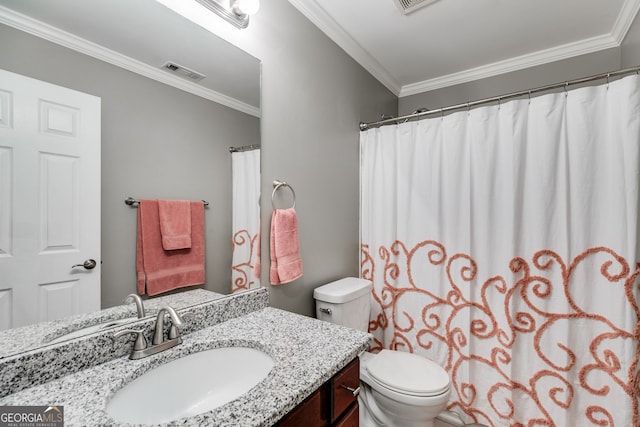 bathroom with crown molding, vanity, and toilet