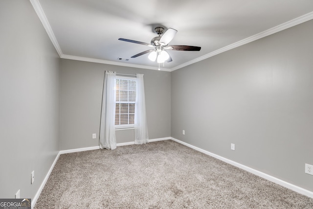 carpeted spare room featuring ornamental molding and ceiling fan