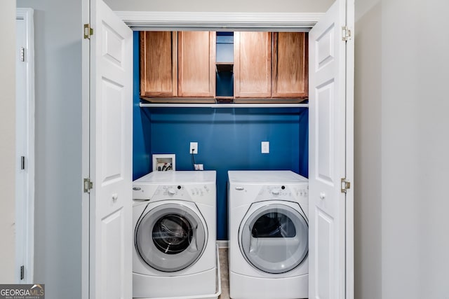 clothes washing area with separate washer and dryer