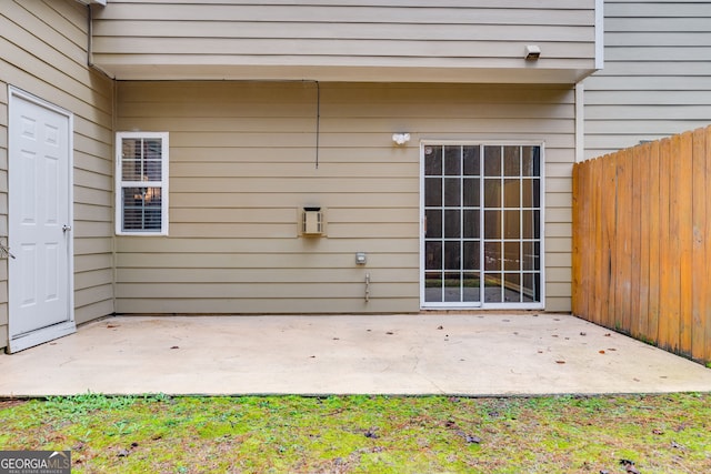 entrance to property with a patio