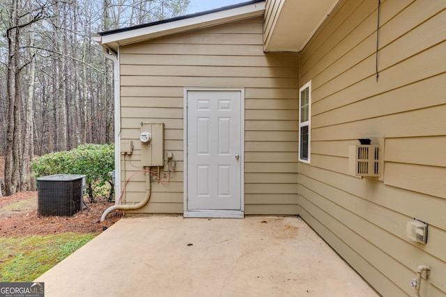 property entrance with central AC and a patio area