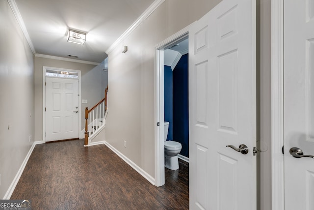 foyer entrance featuring dark hardwood / wood-style flooring and ornamental molding