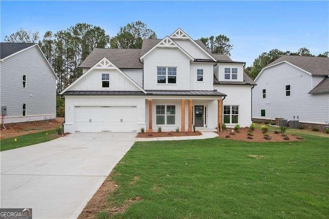 view of front of home with a garage and a front yard