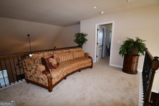 living area with carpet floors, lofted ceiling, and baseboards