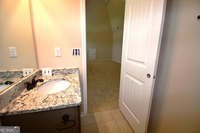 bathroom featuring tile patterned flooring and vanity