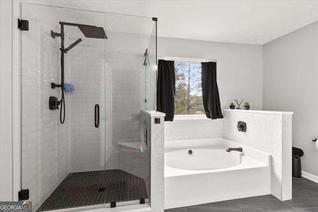 bathroom with separate shower and tub