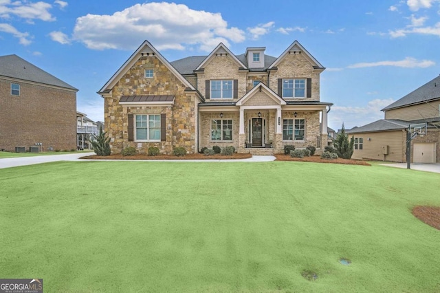 craftsman-style home featuring a front yard