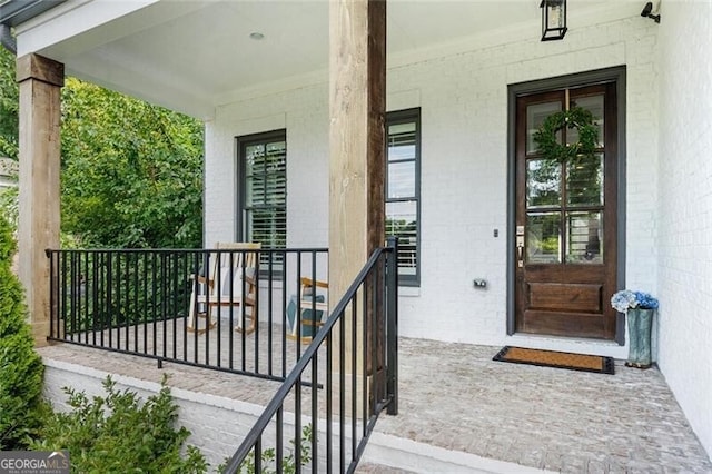 entrance to property featuring a porch