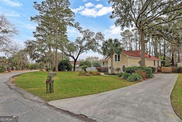 view of home's exterior with a lawn