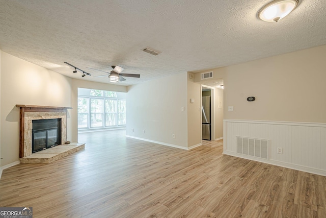 3205 Canyon Point Cir, Roswell, GA 30076 - dining space featuring a wainscoted wall, a textured ceiling, and wood finished floors