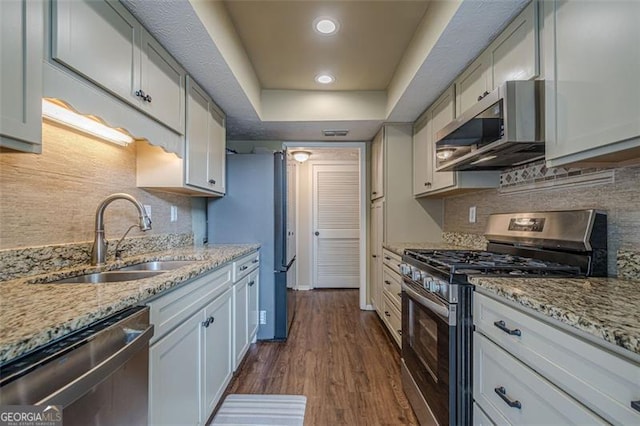 kitchen with white cabinetry, sink, dark hardwood / wood-style flooring, and appliances with stainless steel finishes