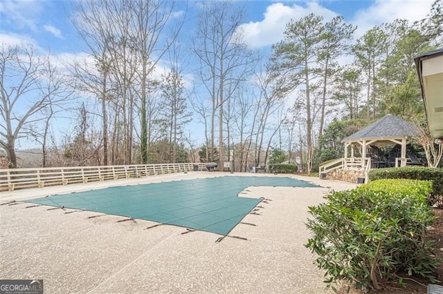 view of swimming pool with a gazebo and a patio