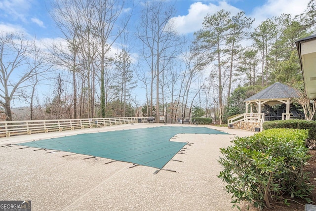 view of swimming pool with a gazebo and a patio area