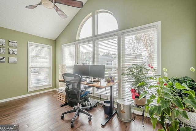 office featuring vaulted ceiling, hardwood / wood-style floors, a textured ceiling, and ceiling fan