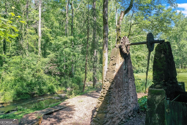 exterior space featuring a forest view