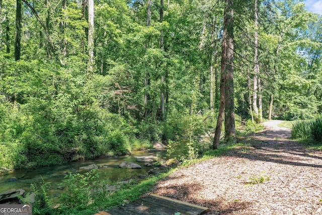 view of landscape featuring a forest view