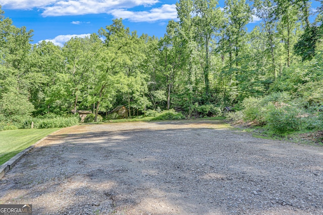 view of street with a wooded view