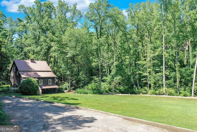 exterior space with a forest view