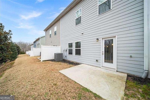 back of house with a patio and central air condition unit