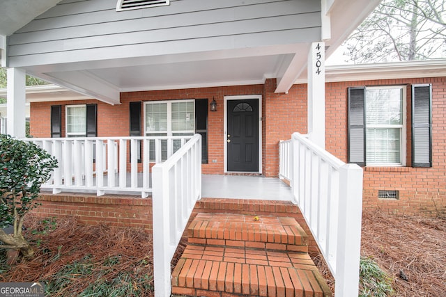 doorway to property with a porch