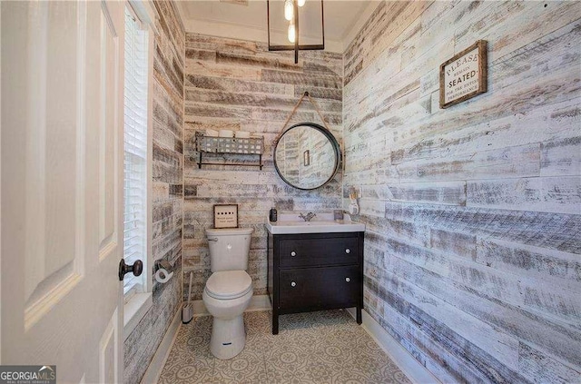 bathroom featuring tile patterned floors, vanity, and toilet